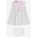Baby girl dress and bloomer set by Paz Rodriguez, featuring a pink knitted top with lace trim and a white flared skirt.