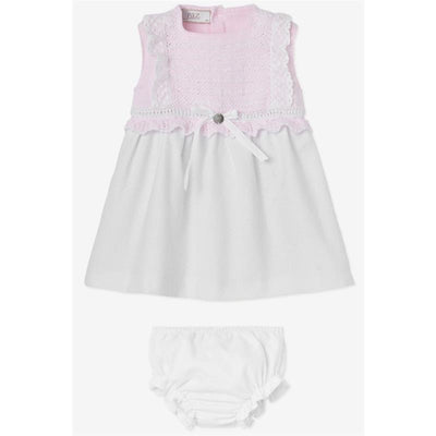 Baby girl dress and bloomer set by Paz Rodriguez, featuring a pink knitted top with lace trim and a white flared skirt.
