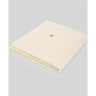 Knit newborn blanket in Oz Beige, featuring a textured design and a decorative button at the center.