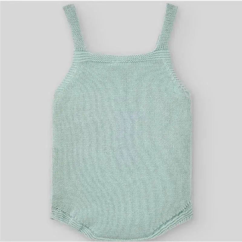 Baby knit bodysuit in cream and beige colors with thin straps, designed for newborns. Soft, textured knit fabric.