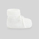 Deep blue newborn booties with a knitted design, featuring a cuffed top and adjustable laces for comfort.