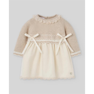 Light pink and cream knit newborn dress featuring long sleeves, lace trim, and two waist ribbons.