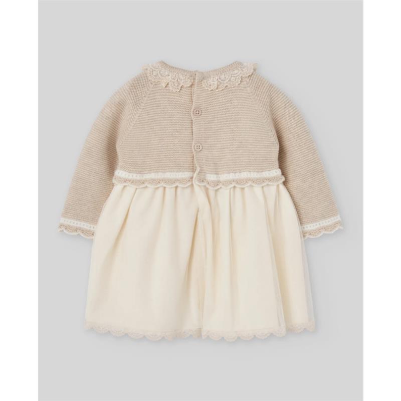 Light pink and cream newborn dress with knitted bodice, lace trim, and button closure on the back.