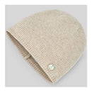 Light brown knitted newborn hat with a folded brim and a decorative button on the side.