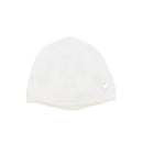 Cream and beige knitted newborn hat with a folded brim and a decorative silver button detail.