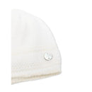 Cream and beige baby knit newborn hat by Paz Rodriguez, featuring a silver logo tag on the side.