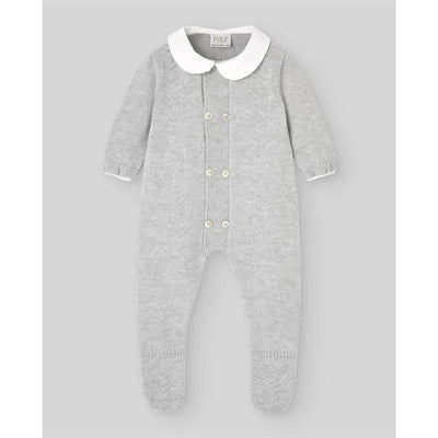 Grey pearl baby knitted romper with a white collar, buttoned front, and footed design by Paz Rodriguez.