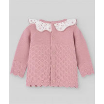 Baby knit newborn sweater in makeup pink with floral collar and decorative buttons. Features textured pattern and scalloped edges.