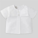 White short-sleeve baby blouse with grey stitched collar detail and button fastening, from Paz Rodriguez.