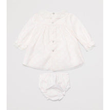 Light pink woven newborn dress with long sleeves and buttons, accompanied by matching bloomers.