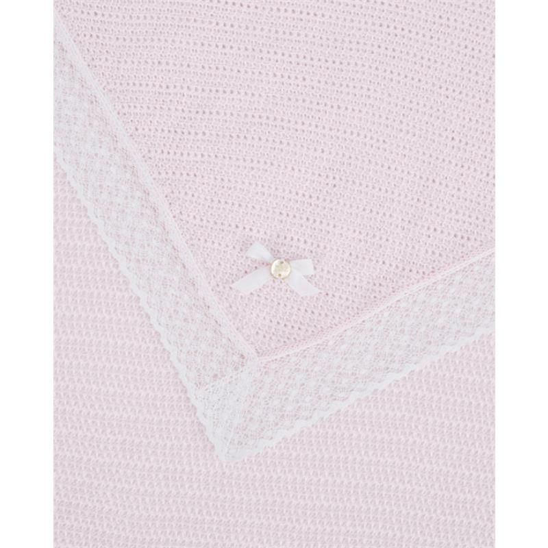 Paz Rodriguez Alaia blanket in chalk pink and white, featuring a textured design and a decorative white bow with a pearl.
