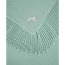Paz Rodriguez Blanket in white and chalk pink, featuring a textured knitted edge and a decorative bow detail.