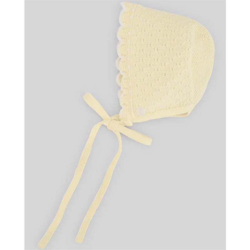 Knitted yellow baby bonnet with scalloped edges and ties, featuring a decorative button.