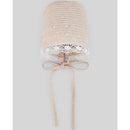 Paz Rodriguez Punto Nectar hat in linen and white, features a knitted design with lace trim and ties for secure fit.