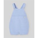 Light blue knitted dungarees for newborns, featuring buttons at the straps and bottom, designed by Paz Rodriguez.