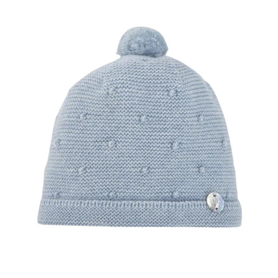 Knit newborn hat in chalk blue with a pom-pom on top and textured pattern details.