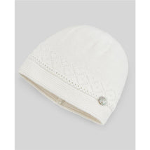 Light blue and cream knit newborn hat with a diamond pattern and a decorative button on the side.