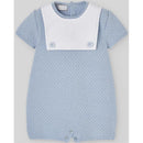Knit newborn romper in sky blue with a white collar and two blue buttons, featuring a textured pattern.