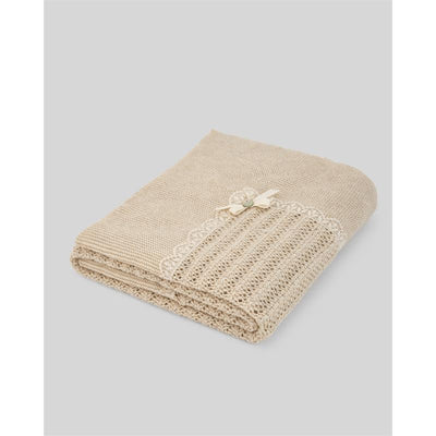 Knit newborn shawl in light brown featuring a delicate lace design and a small bow accent.