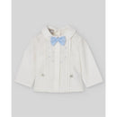 Newborn blouse in cream with light blue bow, featuring pleats and decorative blue dots, designed for formal occasions.
