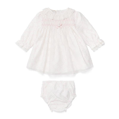 Light pink woven newborn dress with floral details and matching bloomers, featuring a ruffled collar and button accents.