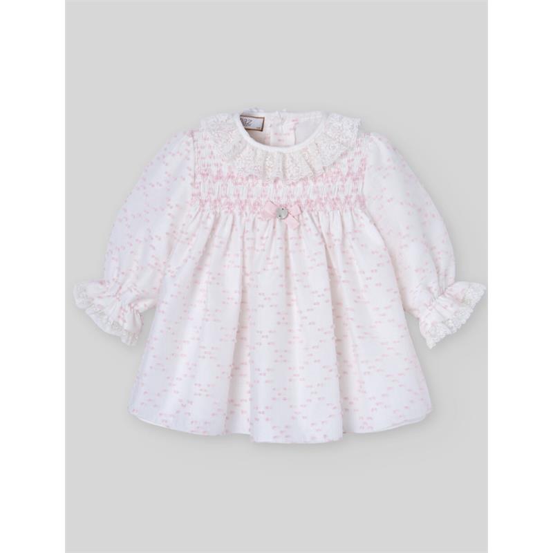 Light pink woven newborn dress with long sleeves, smocked bodice, lace collar, and a decorative button at the center.