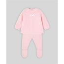 Knit newborn sweater and leggings set in powder pink and cream, featuring a decorative bow on the sweater.