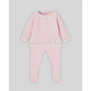 Light pink and cream knit newborn sweater with ruffled neckline and matching leggings, featuring decorative bow detail.