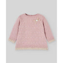 Powder pink knit newborn sweater featuring decorative polka dots, a lace trim, and a bow detail with a button.