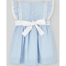 Woven dress for infant girls in chalk blue, featuring lace trim, ruffled sleeves, buttons, and a white bow belt.