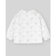 Woven grey pear blouse for newborns featuring a floral pattern and button closure, designed by Paz Rodriguez.