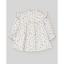Woven newborn dress by Paz Rodriguez in cream with blue floral patterns and ruffled sleeves.
