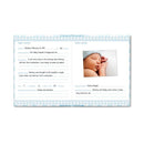 Blue Pearhead Baby First 5 Years Memory Book open to pages detailing birth information with a photo of a sleeping baby in a knit cap.