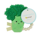Broccoli-shaped crinkle teether in green with smiling face and attached bead ring, suitable for ages 0 months and up.