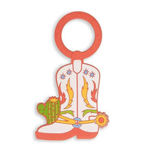 Cowboy boot-shaped teether with colorful designs and a circular handle, intended for babies to chew on.