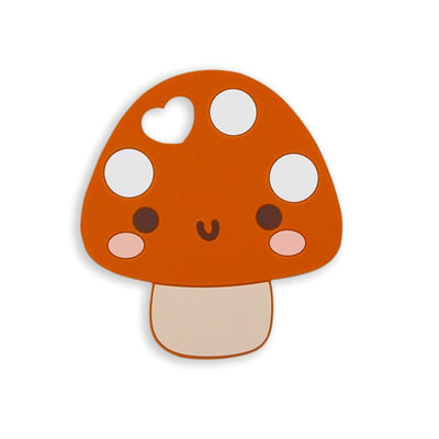 Mushroom-shaped silicone teether in orange with white spots and a smiling face, designed for infants.