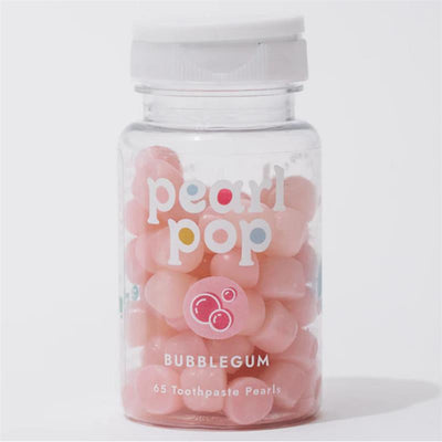 Transparent container of Pearl Pop bubblegum-flavored toothpaste pearls, featuring 65 pearls and playful branding.