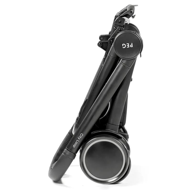 Folded Peg City Loop Urban Mobility Infant Car Seat and Stroller Combo in True Black, showcasing its compact design and wheels.
