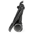 Folded Peg City Loop Urban Mobility Infant Car Seat and Stroller Combo in True Black, showcasing its compact design and wheels.