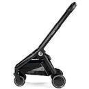 Peg City Loop Urban Mobility Infant Car Seat and Stroller Combo in True Black, featuring a sleek design and storage basket.
