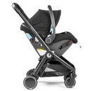 Peg City Loop Urban Mobility Infant Car Seat and Stroller Combo in True Black, featuring a safety harness and adjustable handle.