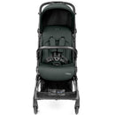 Compact Peg Perego Volo stroller in sage green, featuring a cushioned seat, safety harness, and storage basket below.
