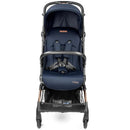 Compact blue stroller with a padded seat and safety harness, featuring a small storage basket underneath.