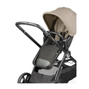 Peg YPSI Single-to-Double Stroller in Vanilla Blend, featuring a tan canopy and black seat fabric, suitable for infants and toddlers.