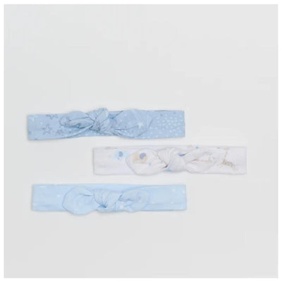 Three blue jersey headbands tied in knots, featuring patterns of stars and clouds, from the Piccolo Bambino 3Pk.