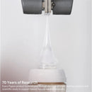 Pigeon silicone nipple for infants, with a clear tip extending from a bottle, showcasing its design and research background.