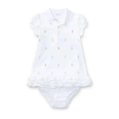 Ruffled white polo dress with colorful embroidered logos and matching bloomer, designed for baby girls.