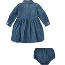 Shirred denim shirtdress in indigo for babies, featuring long sleeves and a flared skirt, accompanied by matching bloomers.
