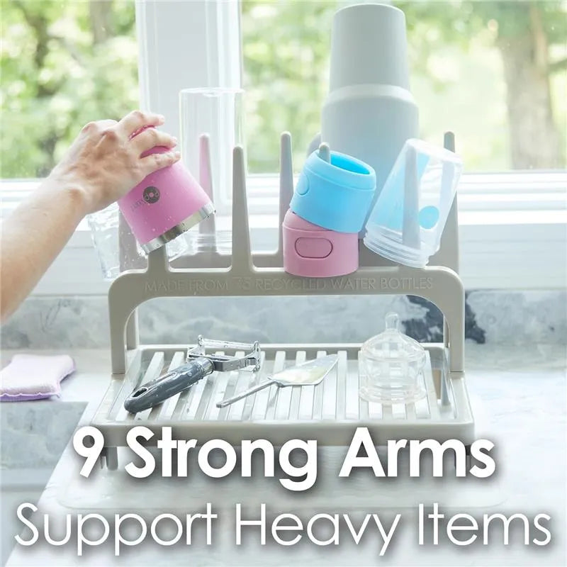 Pop Yum Glacier White Drying Rack with nine strong arms supporting various cups and utensils beside a sunny window.