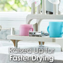 Gray drying rack displaying a pink and blue cup, designed for efficient drying of dishes and made from recycled materials.